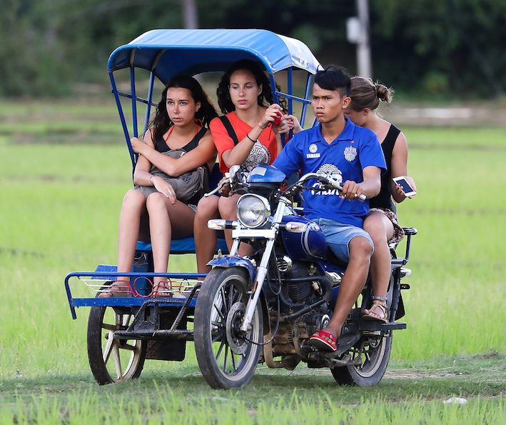 Tuk-tuk_taxi_sidecar_in_Laos.png.ed5049c26cc28f5c97a265543867f158.png